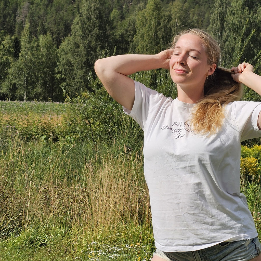 Motivational white t-shirt with "Find The Strength Within You" print – front view